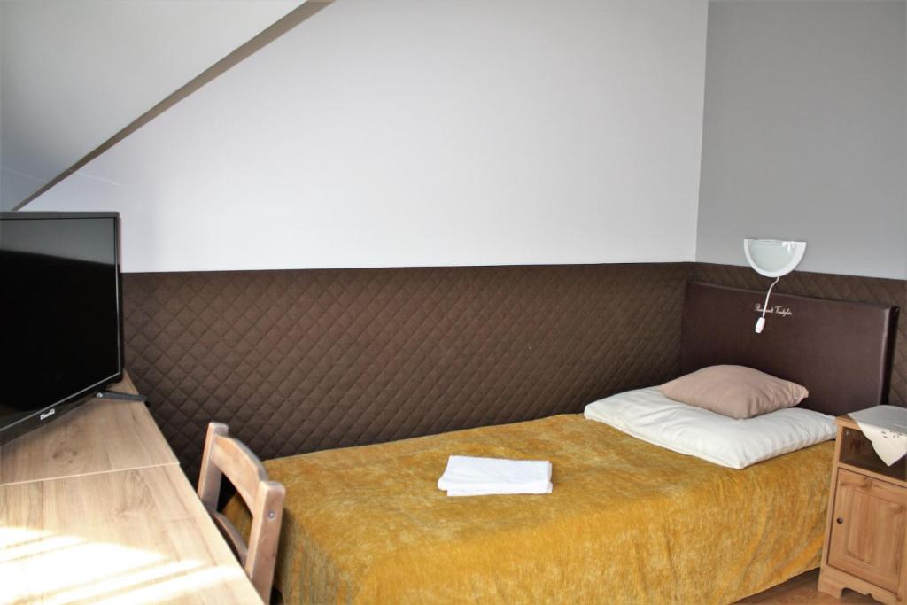 Postel nebo postele na pokoji v ubytování Rembrandt Vendégház