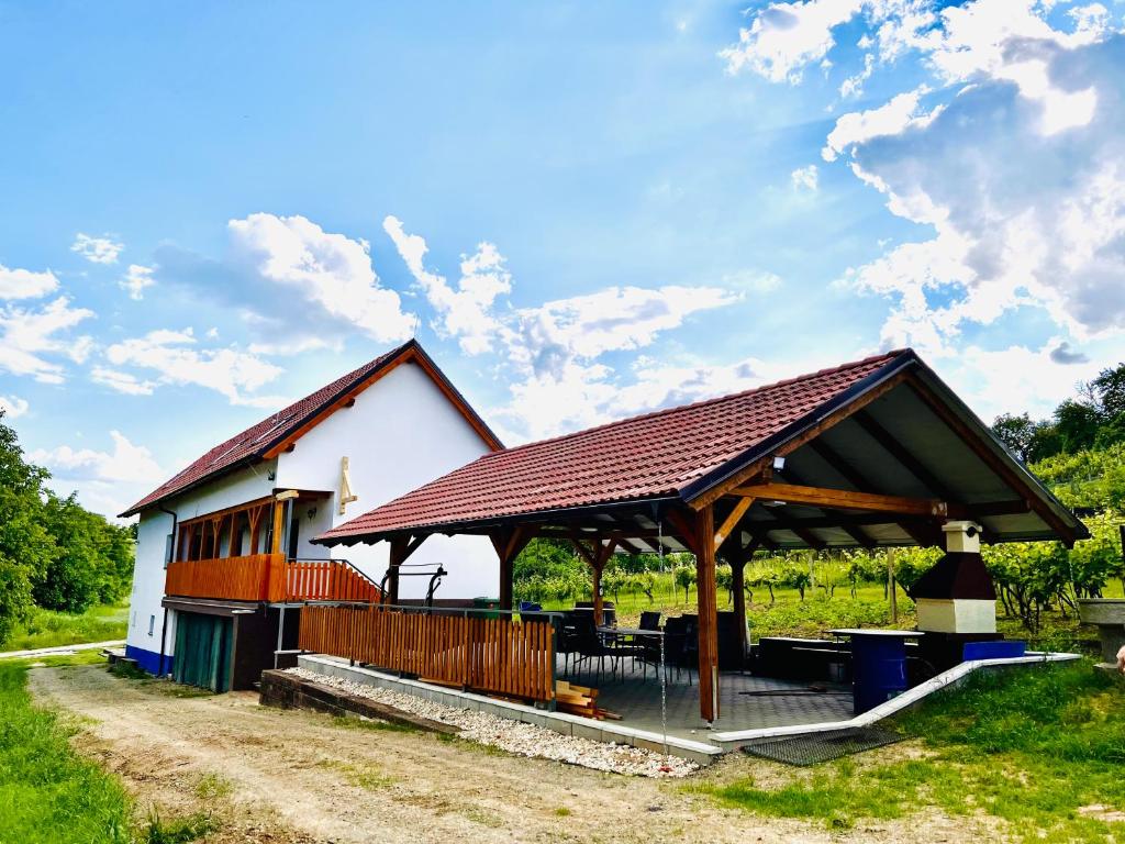 a building with a pavilion in a field at Vinný sklep u Mňa in Mutěnice