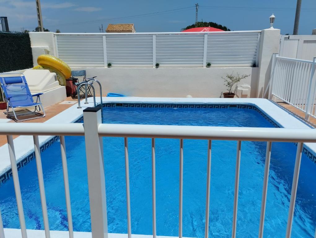 a swimming pool on the balcony of a house at 4 bed house, Private Pool near Beach in Burriana