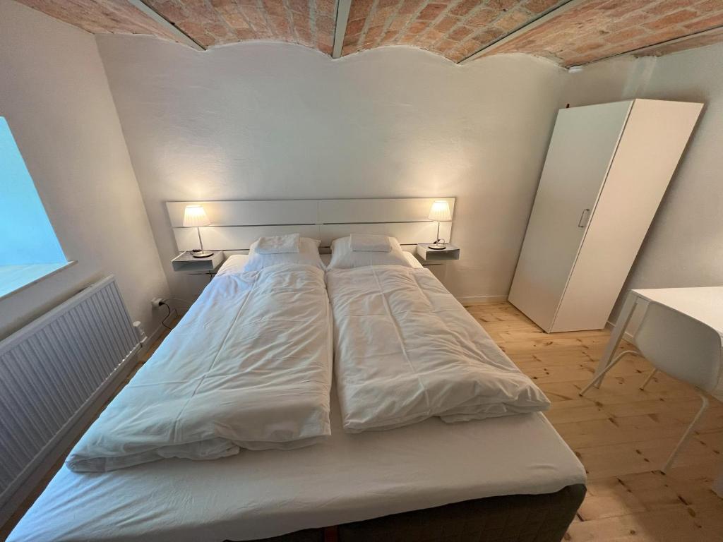 Postel nebo postele na pokoji v ubytování Solbjerg Skov B&B
