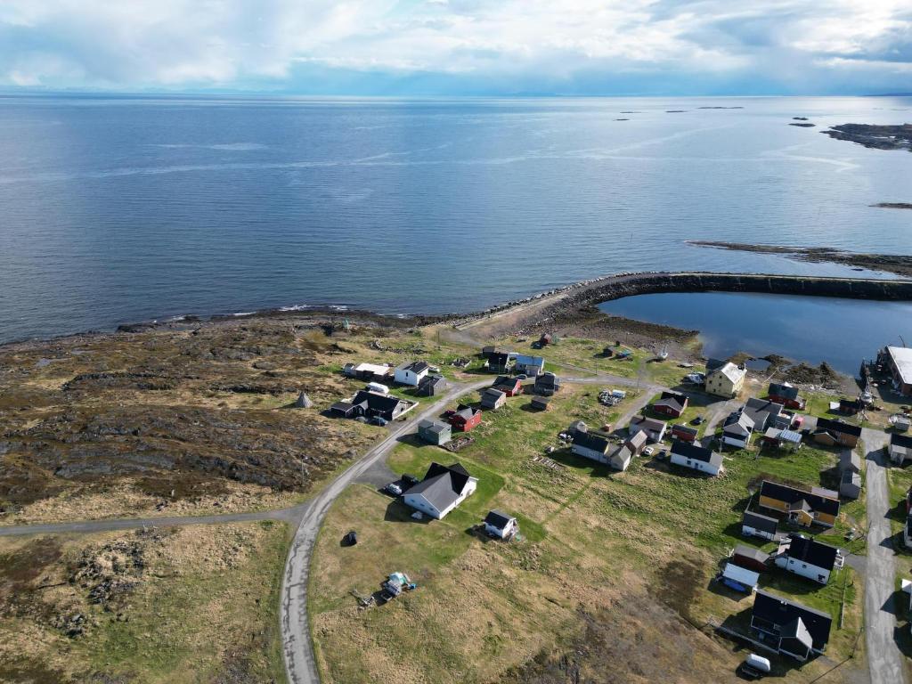 an aerial view of a village on an island in the water at Barents sea window in Ytre Kiberg