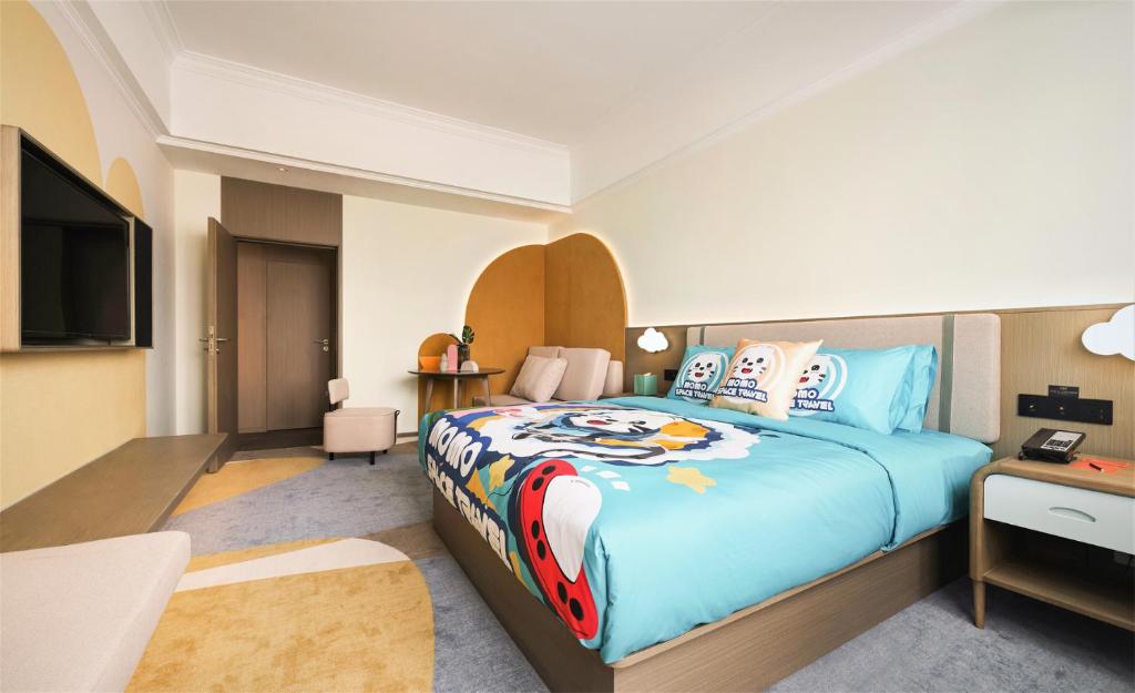 Postel nebo postele na pokoji v ubytování Wanda Yi Hotel Wuxi