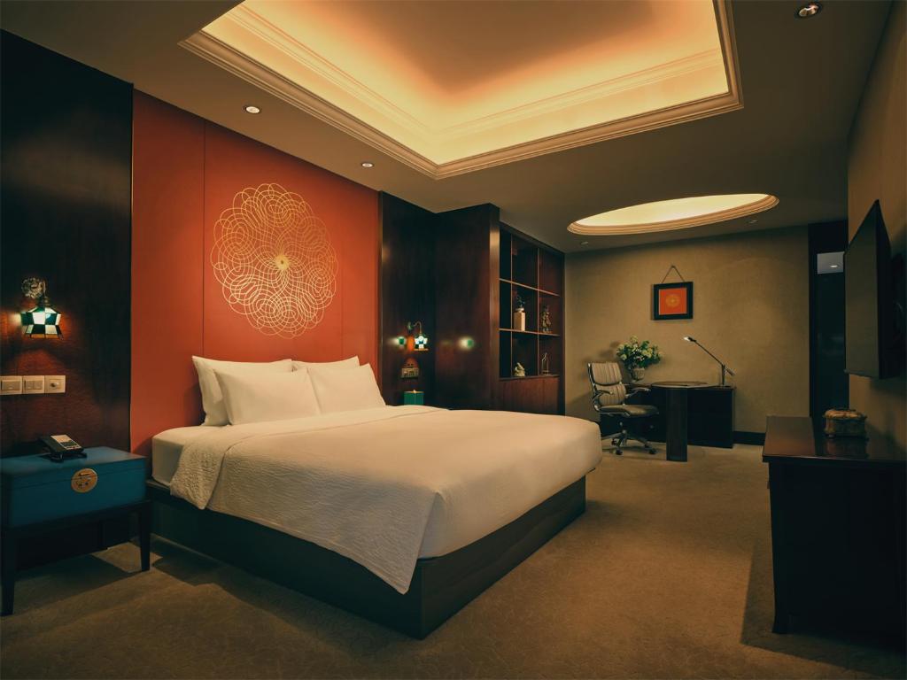 Postel nebo postele na pokoji v ubytování Wanda Yi Hotel Wuxi