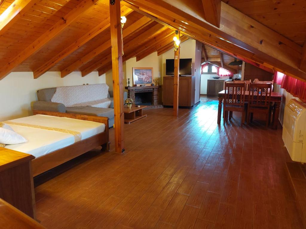 Postel nebo postele na pokoji v ubytování Nostos Apartments