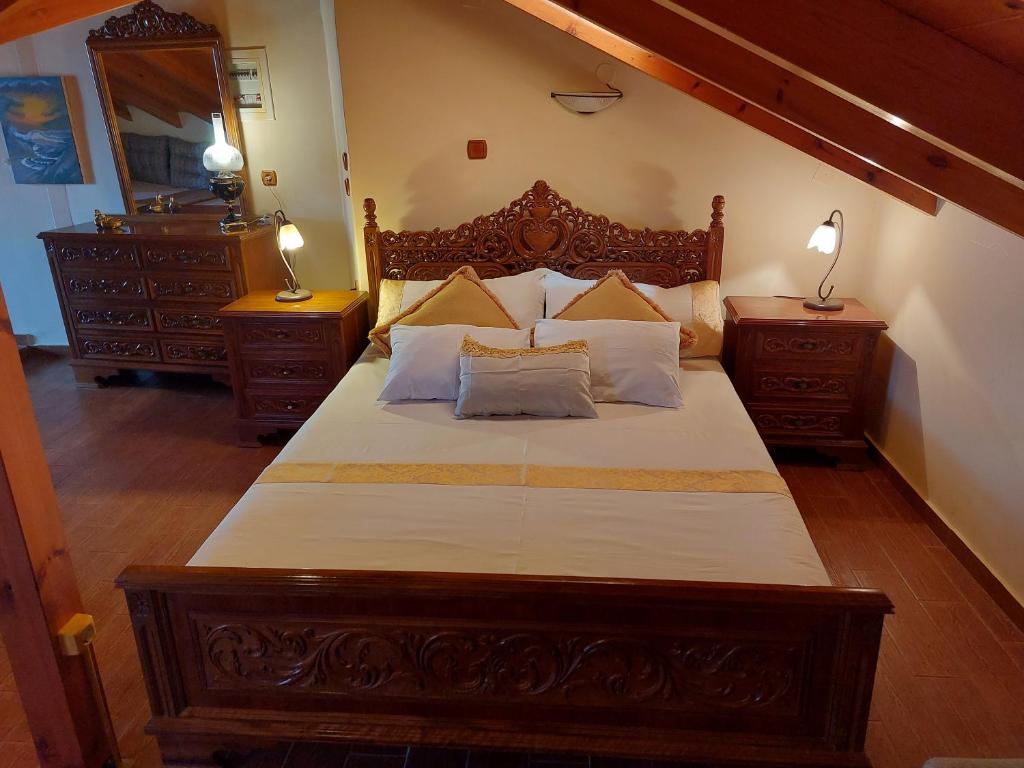 Postel nebo postele na pokoji v ubytování Nostos Apartments