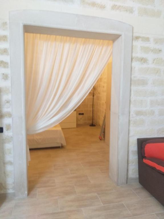 Postel nebo postele na pokoji v ubytování Florooms Dimora in stile Rustico-Moderno
