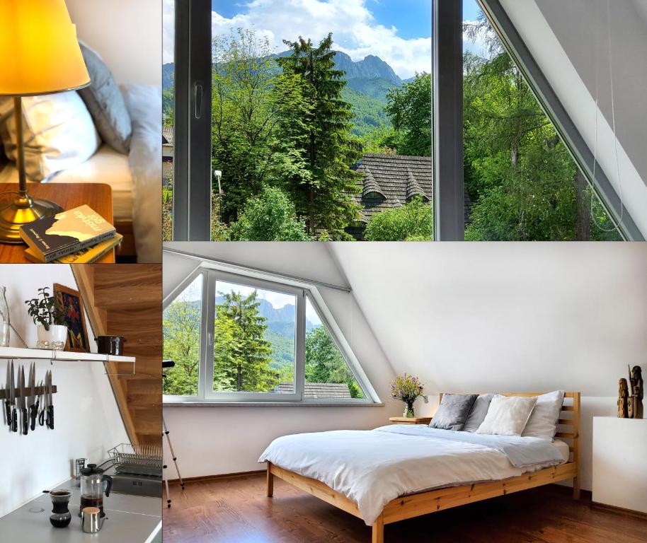 a room with a bed and a large window at Ozwa SKY in Zakopane