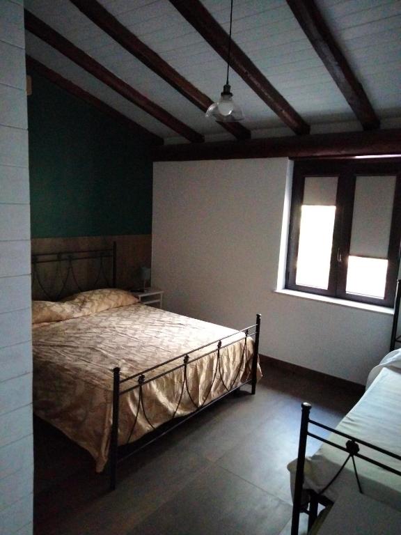 Postel nebo postele na pokoji v ubytování Cuntarati Nature Tourism - Simeto Etna