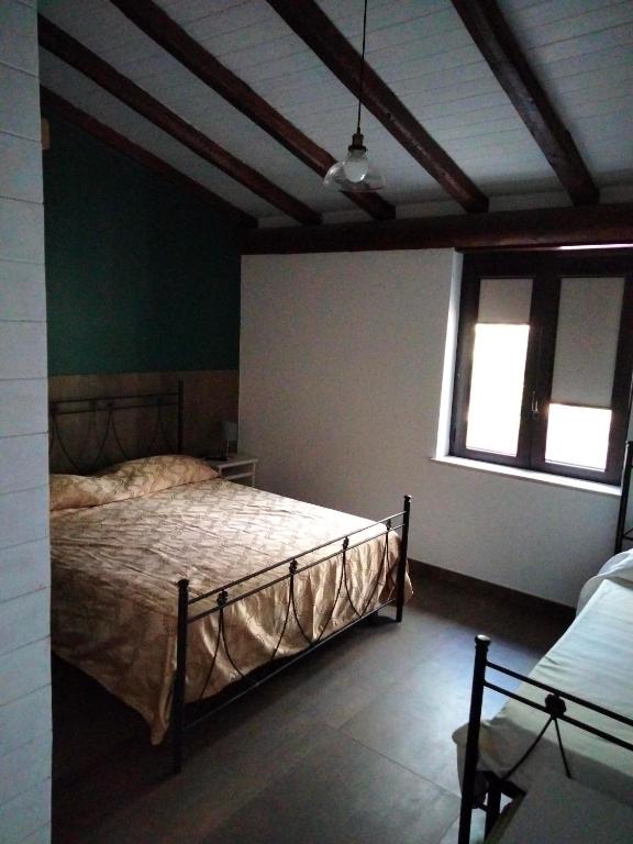 Postel nebo postele na pokoji v ubytování Cuntarati Nature Tourism - Simeto Etna
