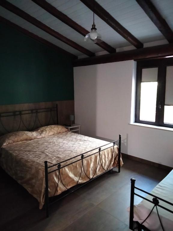 Postel nebo postele na pokoji v ubytování Cuntarati Nature Tourism - Simeto Etna