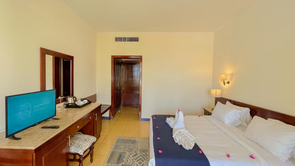 TV a/nebo společenská místnost v ubytování Sharm Reef Hotel