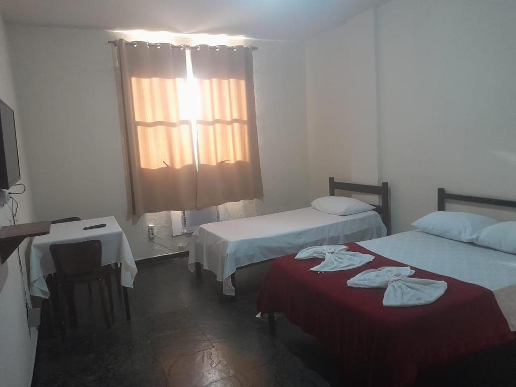 Postel nebo postele na pokoji v ubytování HOTEL DOCE LAR