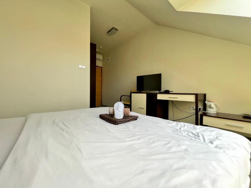 A bed or beds in a room at Penzion Félix