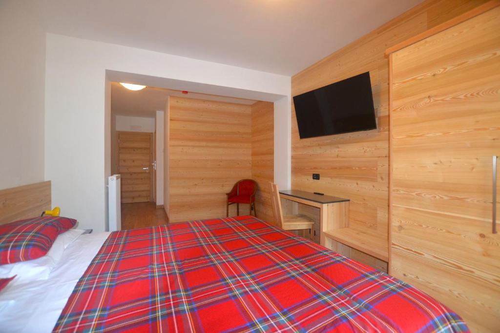 Postel nebo postele na pokoji v ubytování Hotel La Montanina