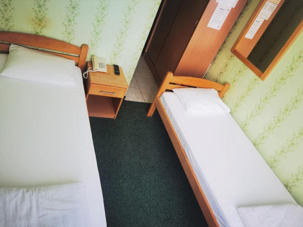 Postel nebo postele na pokoji v ubytování Hotel Slodes