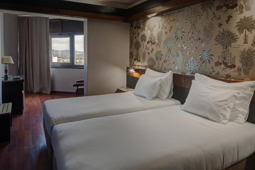Postel nebo postele na pokoji v ubytování Hotel Lara