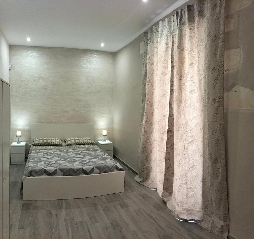 Postel nebo postele na pokoji v ubytování Square House Casa Vacanze
