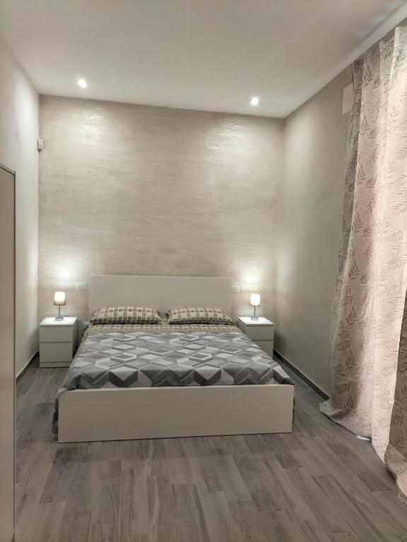 Postel nebo postele na pokoji v ubytování Square House Casa Vacanze