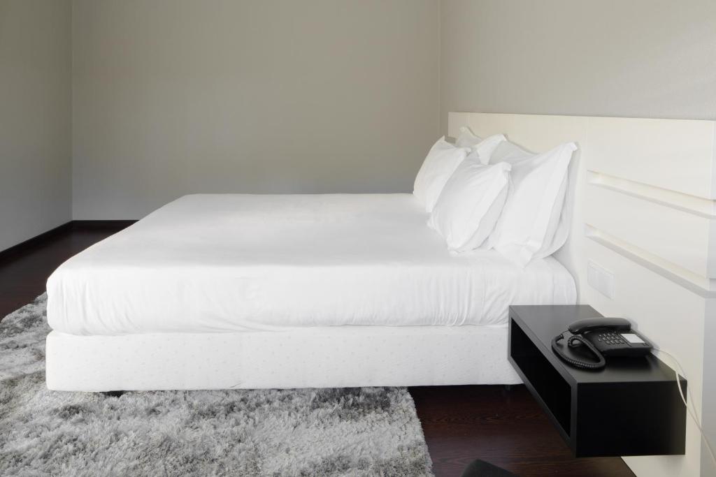 Postel nebo postele na pokoji v ubytování Hotel Lara