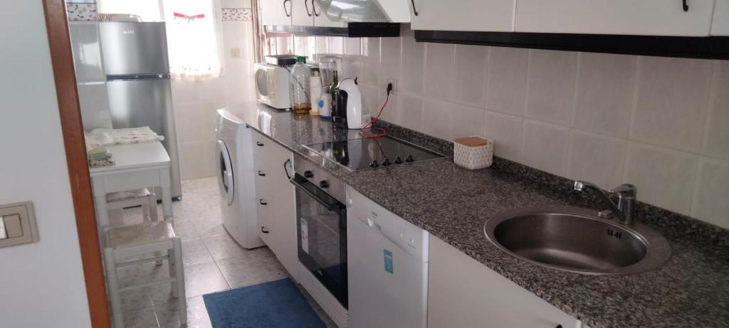 Kuchyň nebo kuchyňský kout v ubytování Apartamento Atico Altar