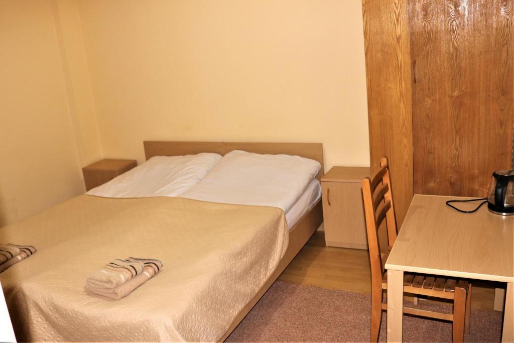 Postel nebo postele na pokoji v ubytování Taoskari Hotel
