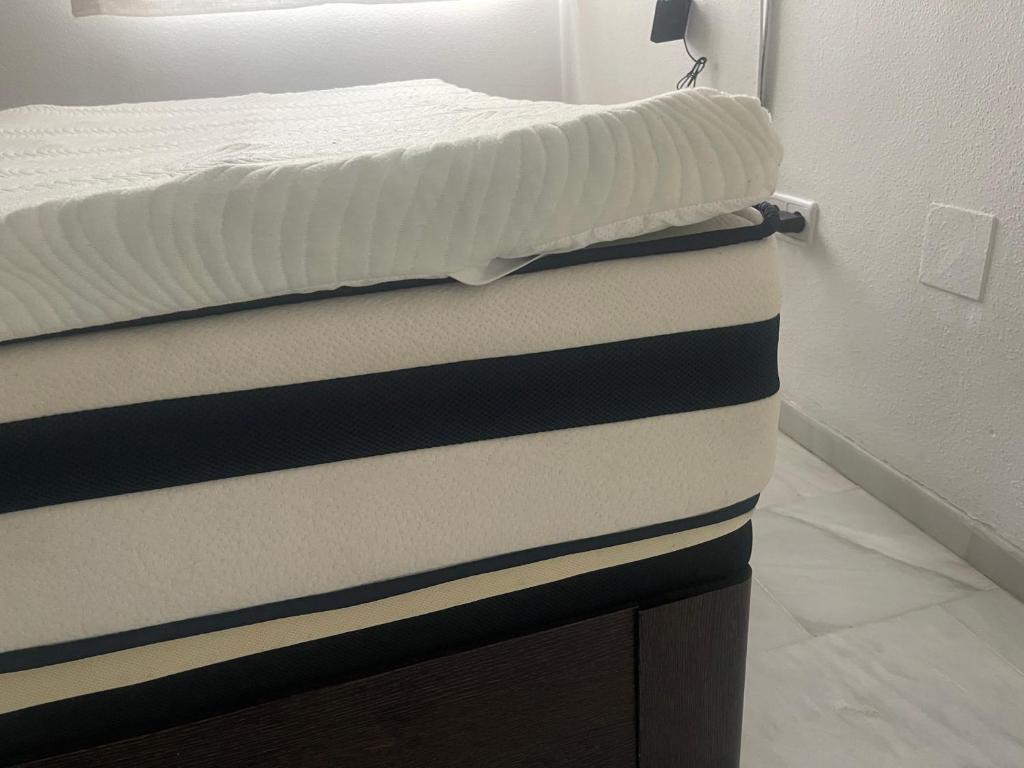 Łóżko lub łóżka w pokoju w obiekcie Atico penthouse