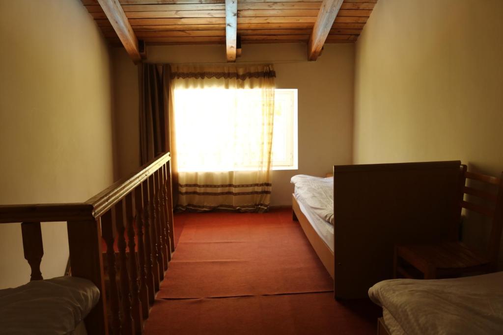Postel nebo postele na pokoji v ubytování Taoskari Hotel