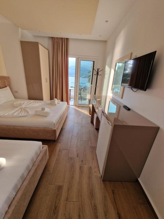 Postel nebo postele na pokoji v ubytování Seaside Hotel