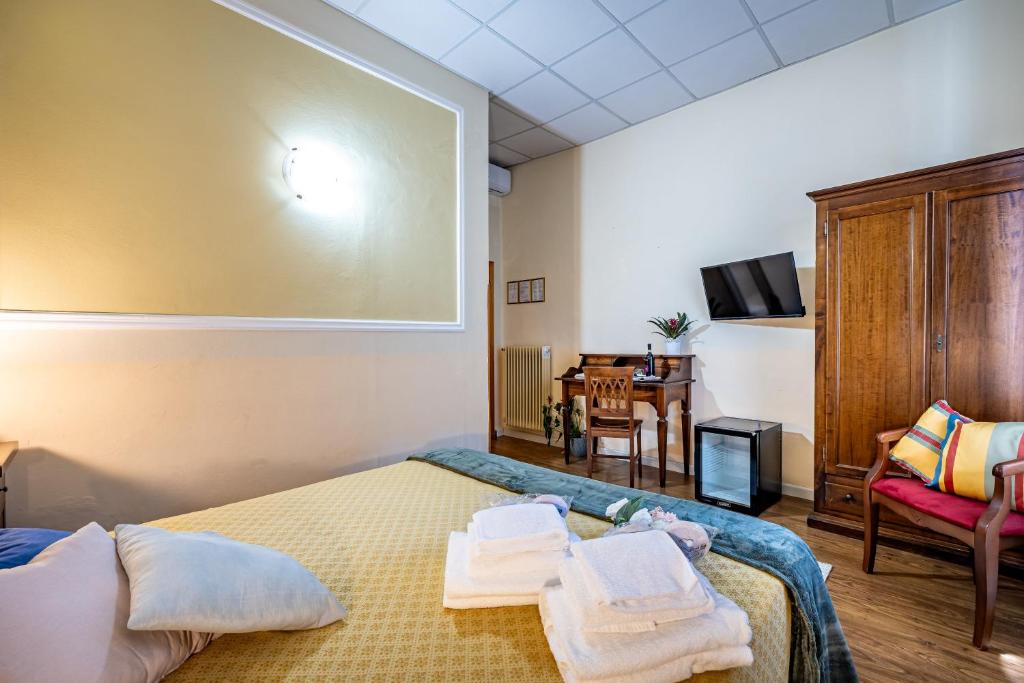 Postel nebo postele na pokoji v ubytování Hotel Minerva