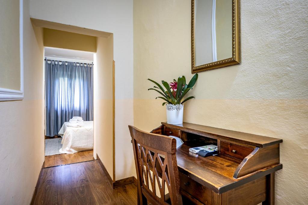 Postel nebo postele na pokoji v ubytování Hotel Minerva