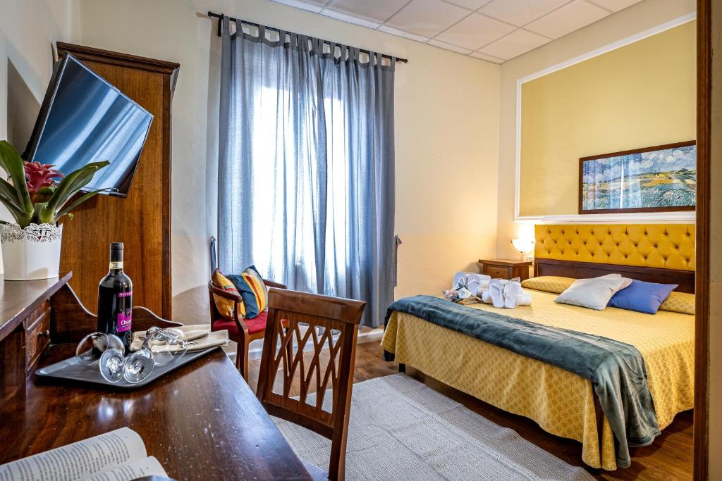 Postel nebo postele na pokoji v ubytování Hotel Minerva