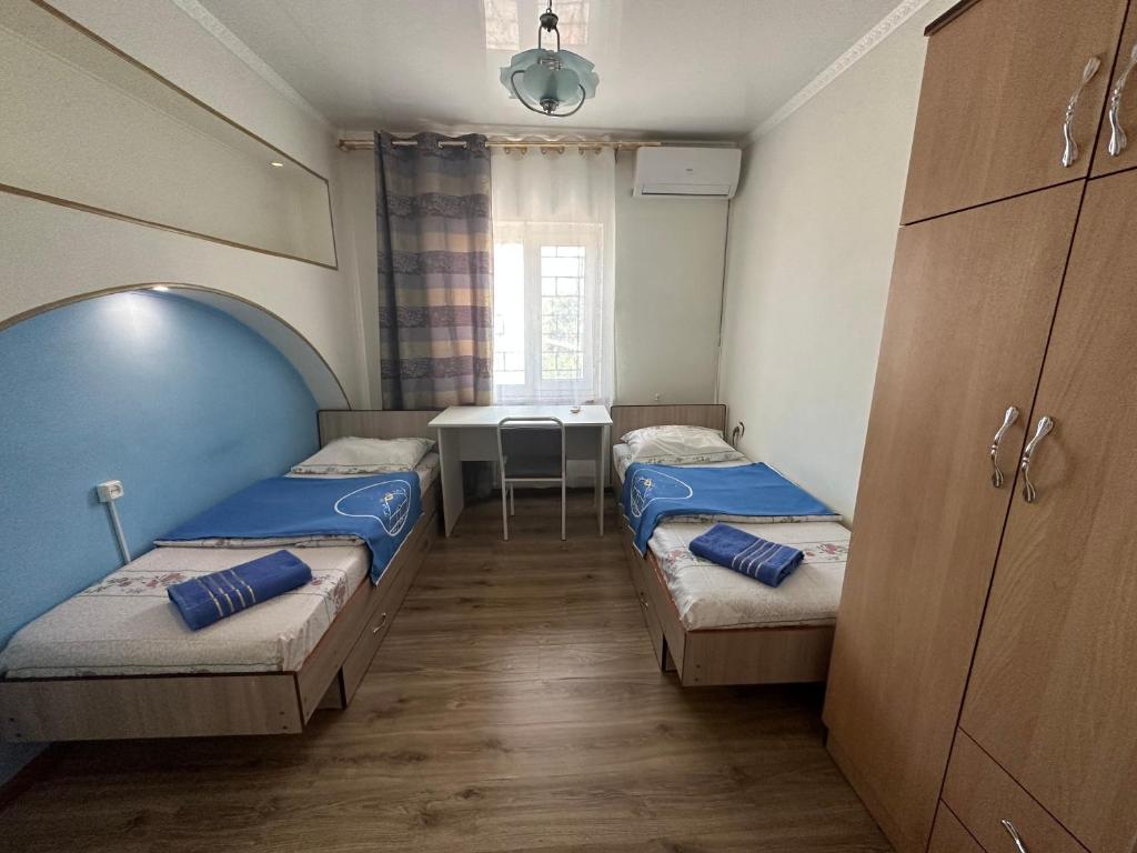 Postel nebo postele na pokoji v ubytování Tunduk Hostel