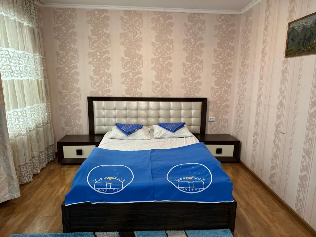 Postel nebo postele na pokoji v ubytování Tunduk Hostel