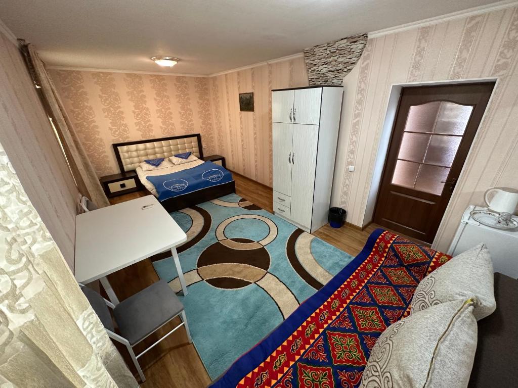 Postel nebo postele na pokoji v ubytování Tunduk Hostel