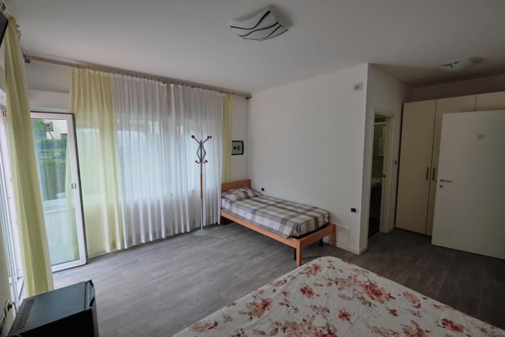 Postel nebo postele na pokoji v ubytování B&B DIVINO