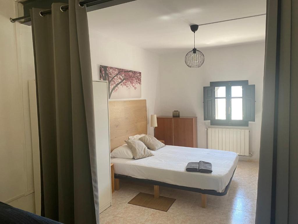 Postel nebo postele na pokoji v ubytování El Molí