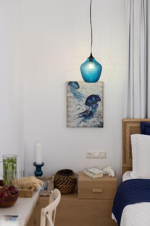 Postel nebo postele na pokoji v ubytování Athina Studios and Suites Plaka