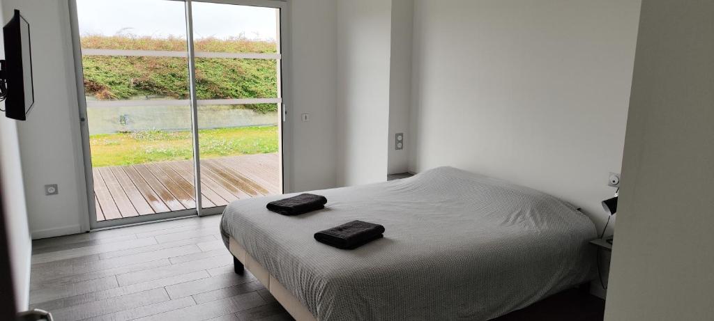 Posteľ alebo postele v izbe v ubytovaní Saint Côme Beach House