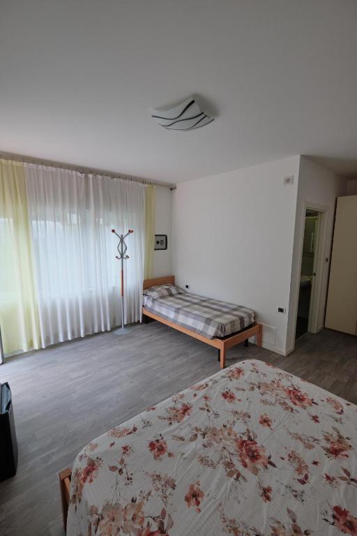 Postel nebo postele na pokoji v ubytování B&B DIVINO