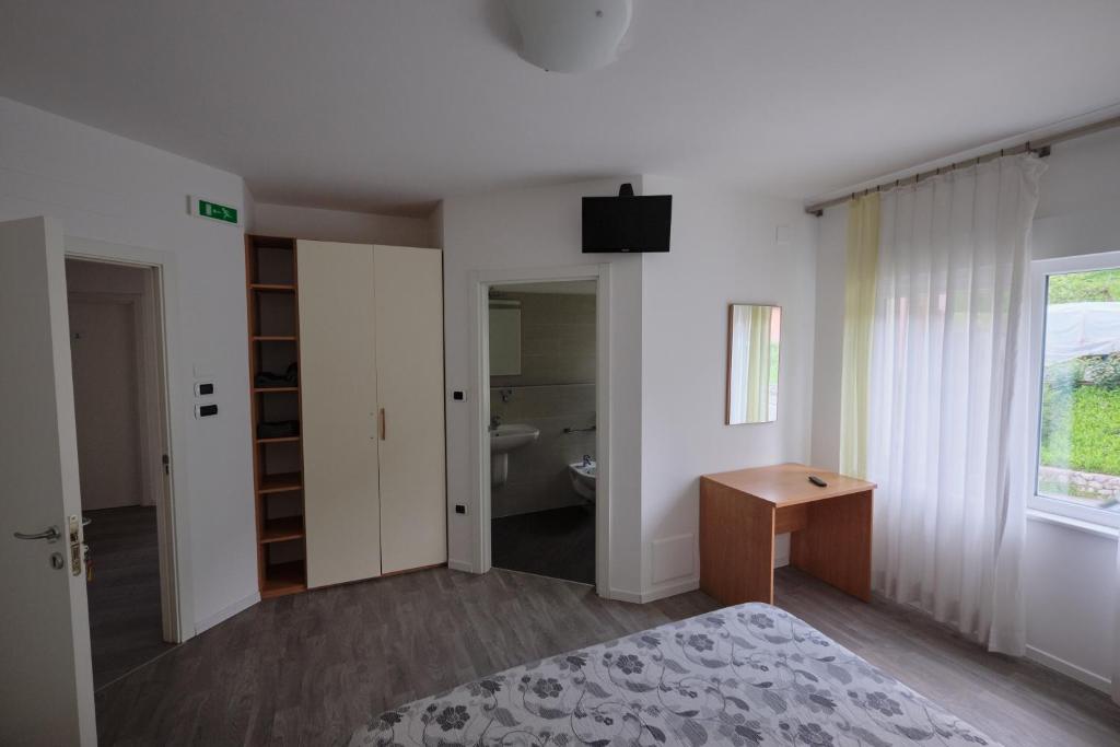 Postel nebo postele na pokoji v ubytování B&B DIVINO