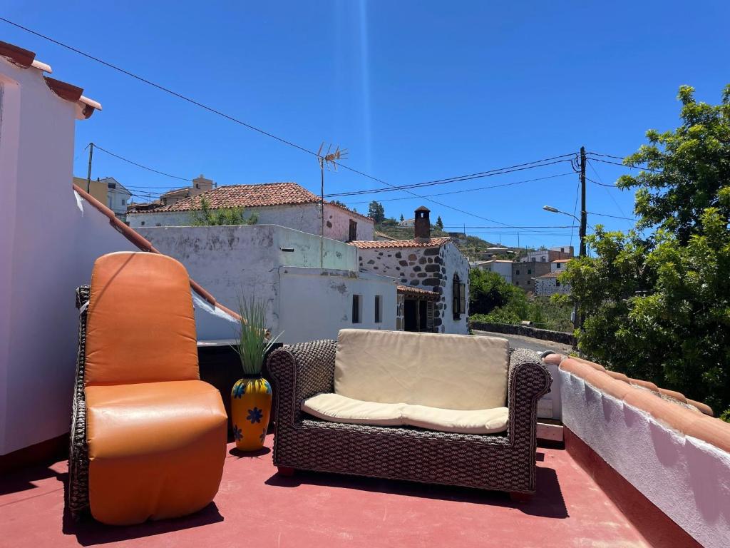 a couple of chairs sitting on a balcony at La Puerta del Sol in Adeje