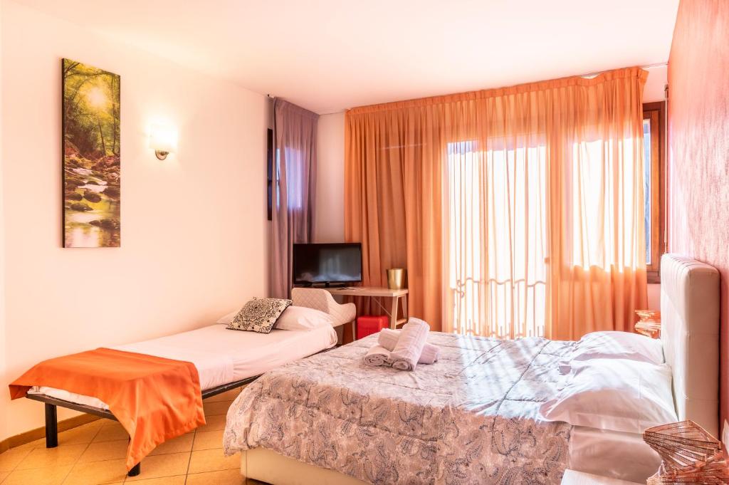 Postel nebo postele na pokoji v ubytování Lake Como Golf Hotel