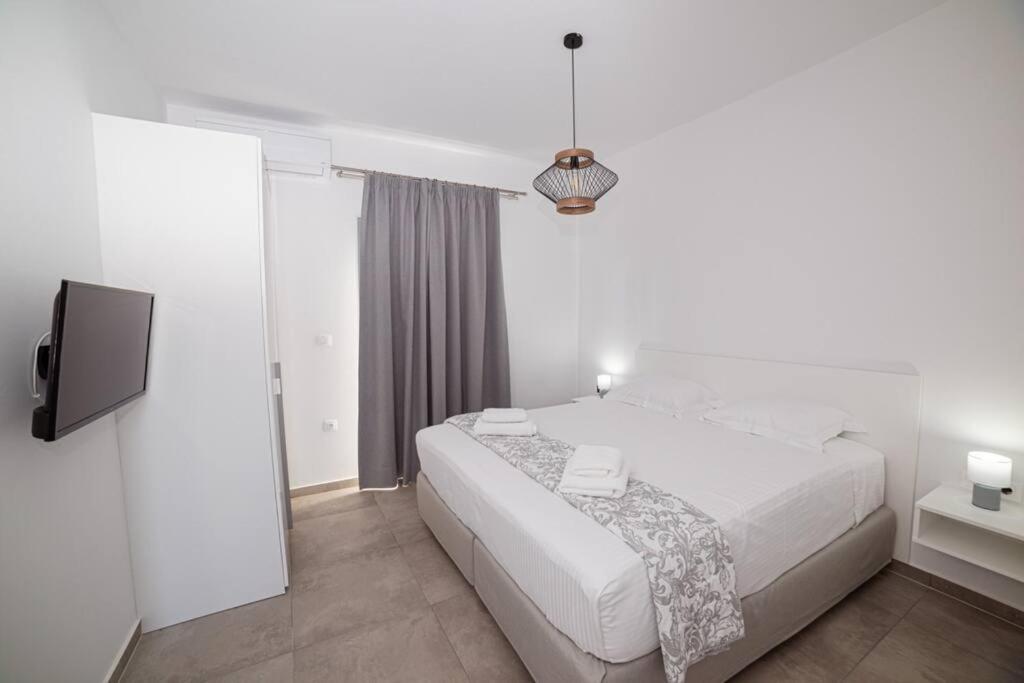 Postel nebo postele na pokoji v ubytování Di La Suite