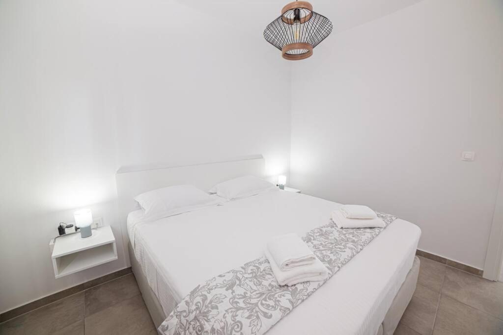 Postel nebo postele na pokoji v ubytování Di La Suite