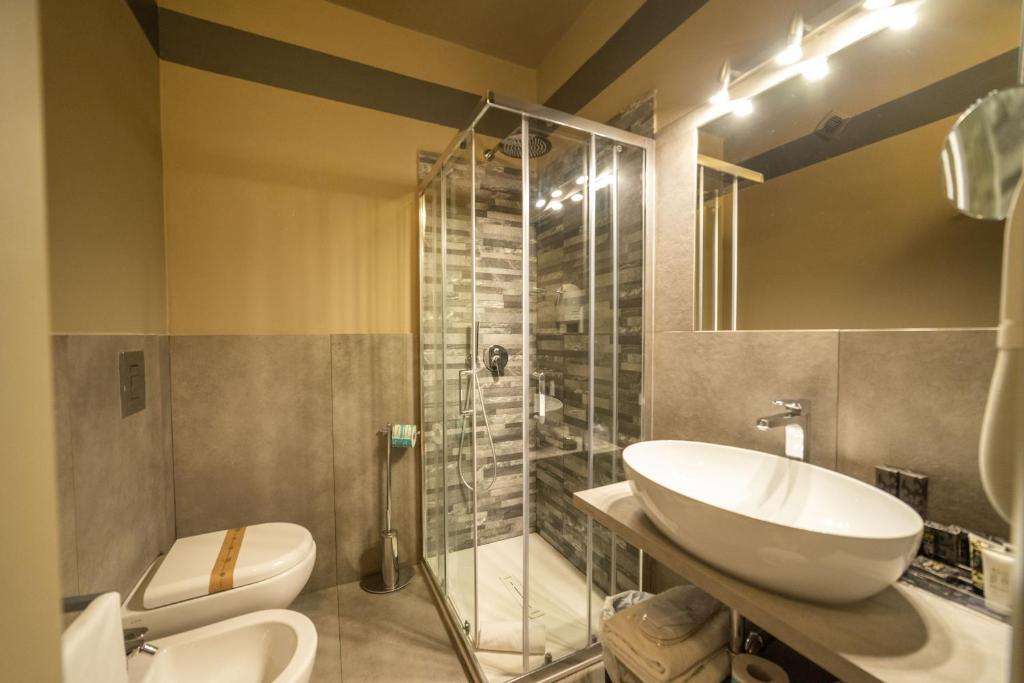Um banheiro em Hotel Villamare