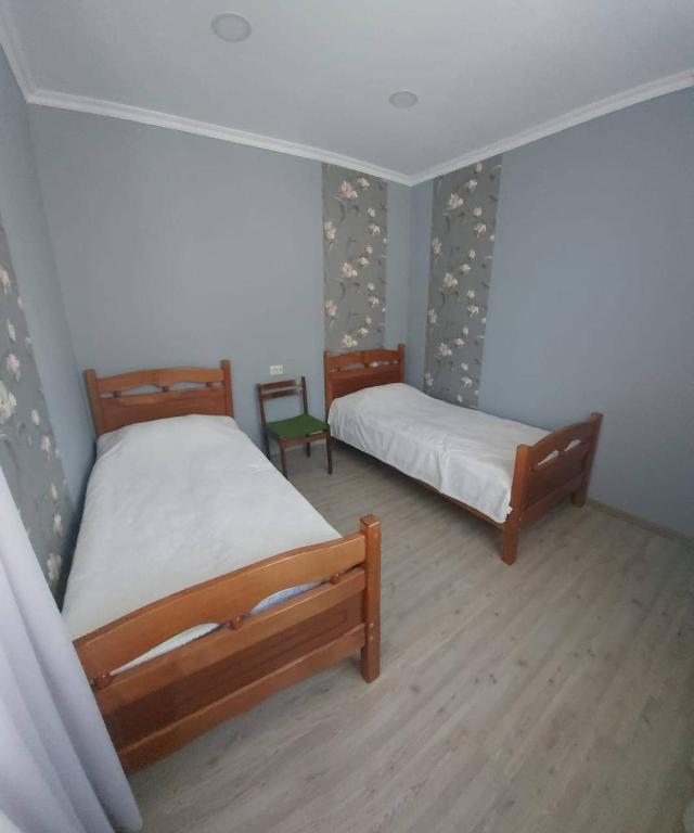 Postel nebo postele na pokoji v ubytování M7 House