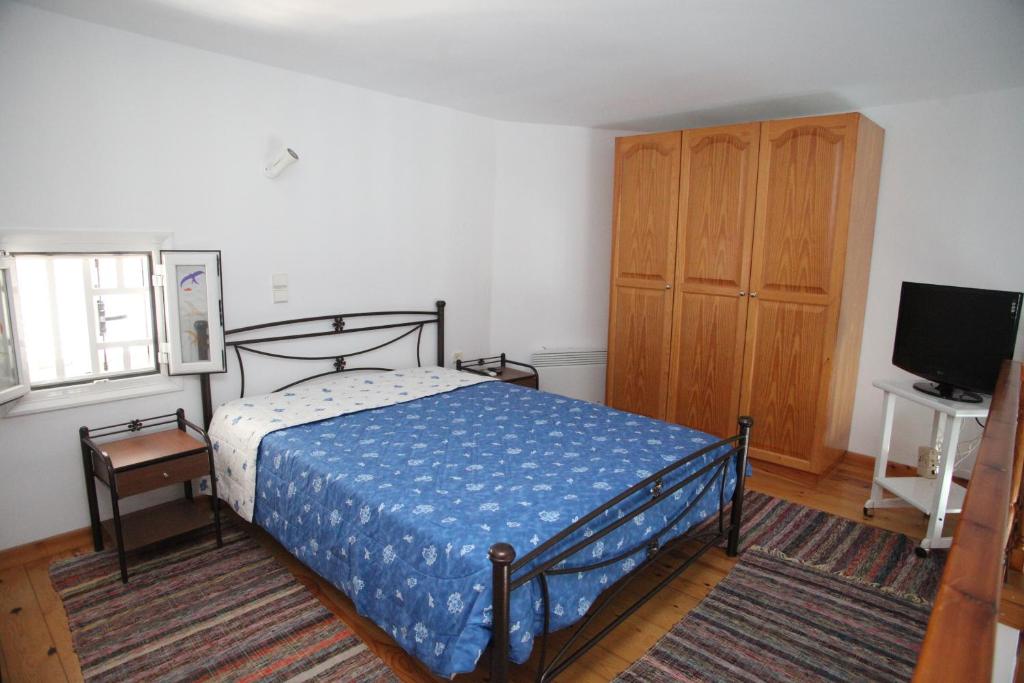 Postel nebo postele na pokoji v ubytování Afroditi Syros