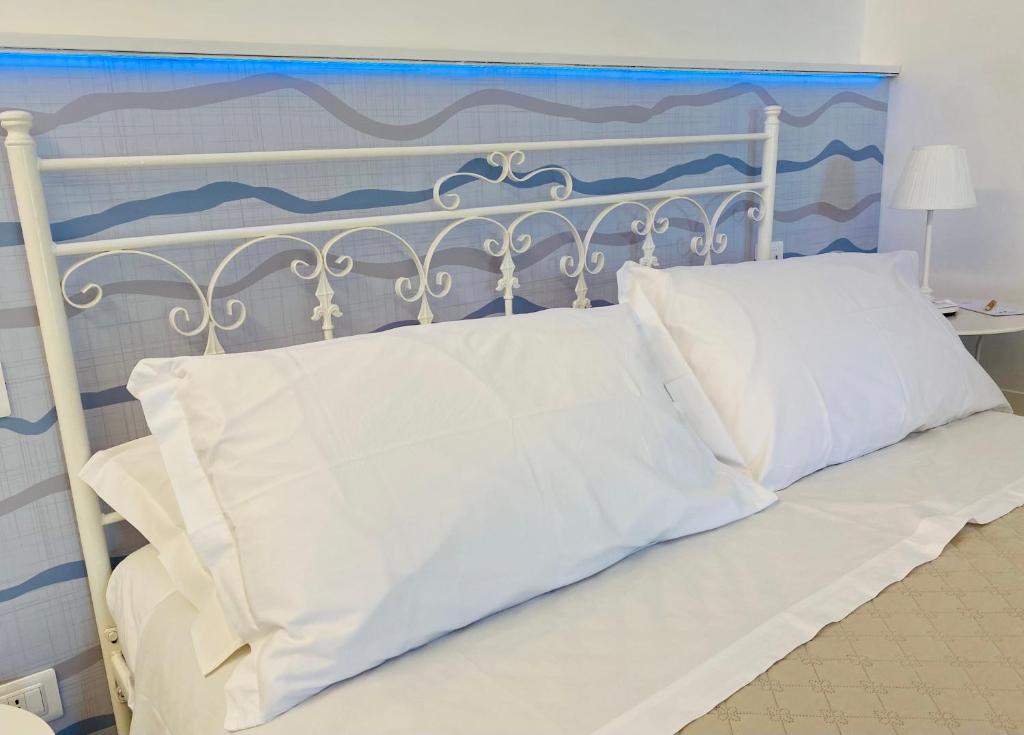 Postel nebo postele na pokoji v ubytování Borgo Incoronata B&B