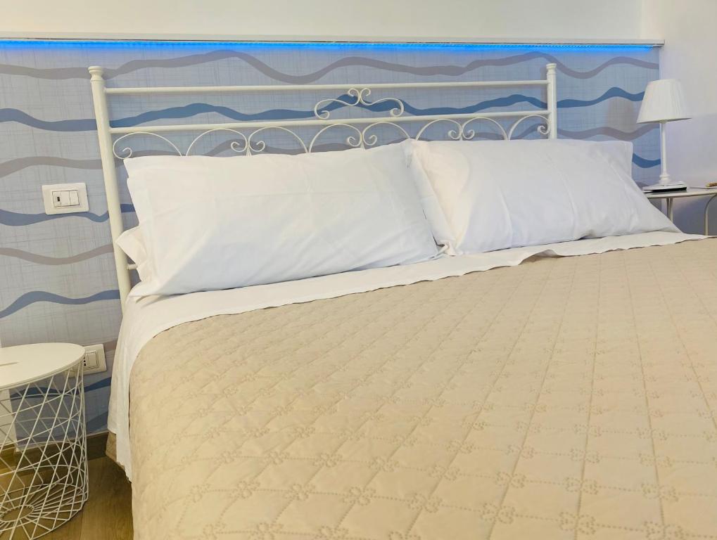 Postel nebo postele na pokoji v ubytování Borgo Incoronata B&B