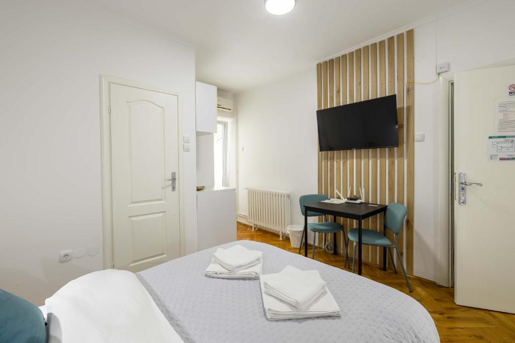 Postel nebo postele na pokoji v ubytování Old Town Rooms